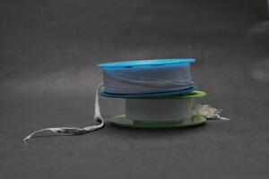 Sealing tape for pipe joints isolated on black background photo