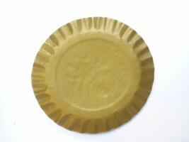 blank gold paper cake plate circle shape isolated on white background photo