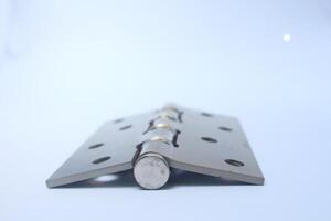close up Metal door hinge isolated on white background photo