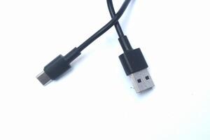 Black USB cable isolated on white background,connectivity connector tool photo