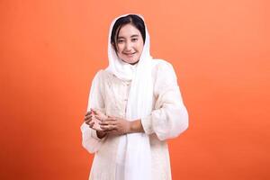 Smiling Woman in White Hijab, A portrait of inner peace and cult photo