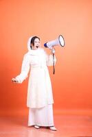 Determined woman with megaphone broadcasting powerful message, s photo