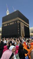 MECCA, SAUDI ARABIA - MAY 02 2024. View on Kaaba from second floor of Masjid Al Haram through some new constructions building around the masjid. High quality photo