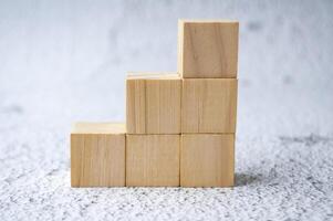 Stacking wooden cubes with customizable space for text. photo