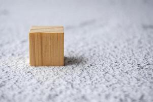A wooden cube with customizable space for text. Copy space concept photo