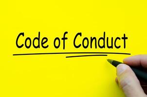 Code of Conduct text on yellow notepad. Business culture concept photo