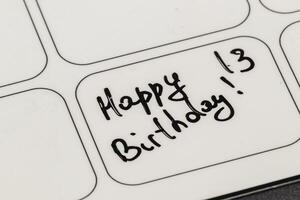 Creative birthday message written on a label with a black marker photo