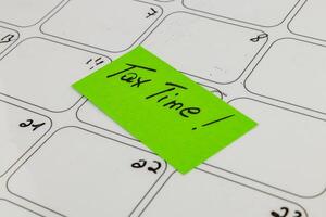 Tax preparation reminder on a calendar for the upcoming deadline photo