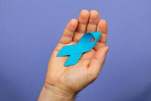 Raising awareness for cancer detection and support with blue ribbon campaign photo