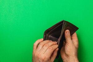 Despair over empty wallet during financial crisis for a businessman photo