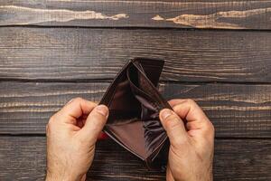Financial despair leads to an empty wallet reflecting personal crisis photo