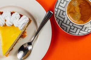 Enjoying a delightful slice of cake alongside a steaming cup of coffee photo