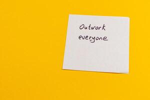 Reminder note promotes collaboration and effort in a bright workspace photo