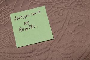Note expressing encouragement placed on textured surface in a cozy setting photo