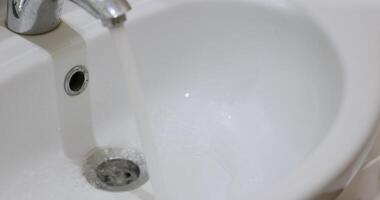 Water Flowing Gently into a Sink A Beautifully Clean and Modern Setting with Style video