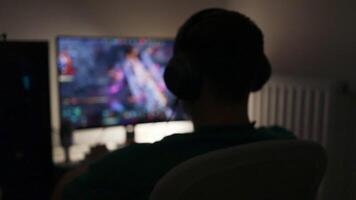 Caucasian gamer using gaming pc professional setup while having fun playing online games at home. Man enjoying relaxing free time streaming multiplayer competition. video