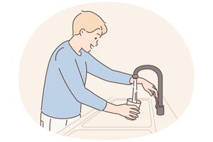 Man draws water into glass from faucet with built-in purifying filter to quench thirst vector