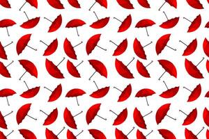 Red umbrellas in a seamless pattern design on a white background for modern decor themes vector
