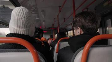Passengers Sitting Inside a Tram Facing Forward on a Cloudy Day video