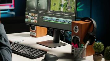 Male editor working on creative software to create montage, using color correction and adding visual effects. Content creator editing graphics and gradient for movie post production. Camera B video