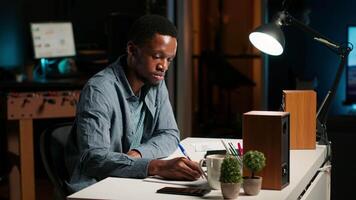 Financial consultant writing capital allocation details from the archives, providing action plan with expenses and earnings. Accounting duties by expert for guidance on growth strategy. Camera B. video