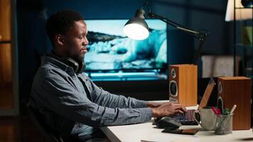 Financial advisor talks to his team on phone call at home office, obtain new business funding from shareholders. Young man doing remote work to increase revenue and reduce cost. Camera B. video