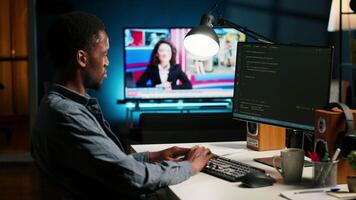 Developer enters binary data on terminal panel while he establishes html code. Software engineer working from home on troubleshooting with programming language, encryption. Camera B. video