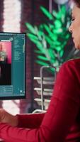 Vertical Graphic designer using AI chatbot turning text prompt into photos and retouching, ensure original content for clients. Creative woman using machine learning for photographer portfolio. Camera A. video