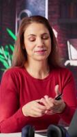 Vertical Mature woman dialing a phone number to make inquiries about productivity, solving tasks remotely from the comfort of her home. Female freelancer on a phone call, briefing. Camera A. video