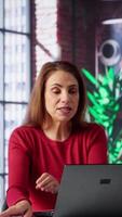 Vertical Female applicant at a virtual job interview chatting via online call, applying for a job vacancy listed on a web recruiting platform. Ambitious woman looking to get hired, job offer. Camera A. video