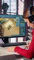 Vertical Female employee creates 3D render of an apartment interior using blueprints and architectural software. Employs computer aided tools and models to allow customization of flooring. Camera B. video