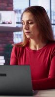 Vertical Mature woman getting angry and yelling on the phone call at the desk, screaming at her employees and being disappointed. Worried person displeased with the low productivity, multitasking. Camera A. video