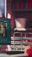 Vertical Software developer at home office coding on desktop using AI powered script, building an interface and implementing programming language algorithms. Engineer uses text to code. Camera A. video