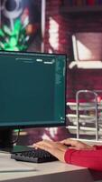Vertical IT engineer at desk generating code algorithm with AI powered chat, programming on monitor and writing lines of code. Woman debugging software on a terminal window interface. Camera A. video