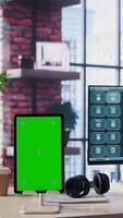 Vertical Independent person using computer with green screen for remote job tasks at home setup, surrounded by notes and enjoying the benefits of schedule flexibility. Modern lifestyle. Camera B. video