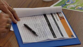 shot of signing the covid19 contact tracing list before entering premises in New Zealand after lock down video