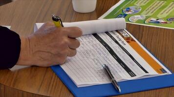 man signing the covid19 contact tracing list before entering premises in New Zealand after lock down video