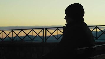 Silhouette Of A Man Sitting On Bench Watching Time Pass After Retirement video