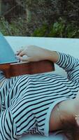 Artist Girl Plays Musical Instrument Ukulele Lying On Bench In Park video