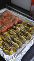 The chef salts and peppers the shrimp and fish on a tray before frying video
