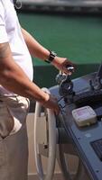 Close-up of the captain's hands at the helm. He controls the movement of the yacht. S video