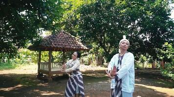 Traditional Dance Performance in a Rural Setting with gazebo in the background video