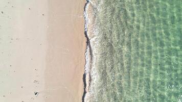 aerial drone view footage of a beach with clear turquoise water , summer time background concept video