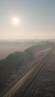 An aerial view of a highway in the fog video