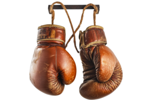 Vintage boxing gloves on display in gym setting png