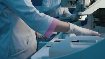 Doctors use lab equipment for an experiment, working with test tubes and samples. Concept scientific research and experiments using cutting-edge technology in the laboratory video
