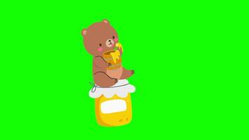 a cartoon bear is sitting on top of a jar of honey video