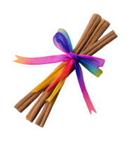 Colorful ribbon tied around a bundle of cinnamon sticks png