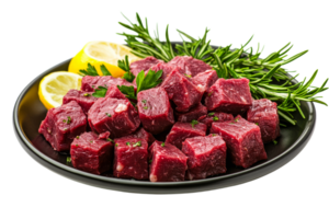 Fresh beef cubes with herbs and lemon on a black plate png