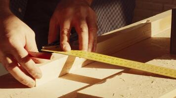 Crafting with precision in a woodworking shop, focusing on measuring and cutting wood materials video